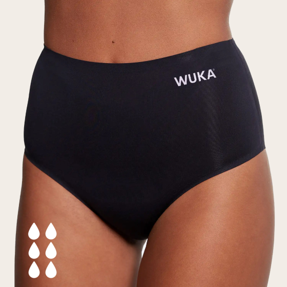 WUKA Super Heavy Flow High Wasted Period Pants in Black shown from the front, on a cream background