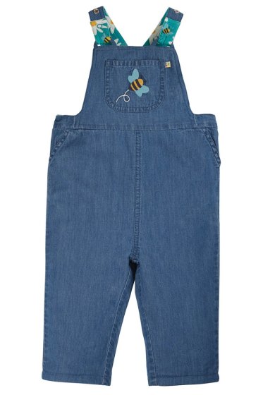 denim reversible dungarees from frugi with the bee applique on the chest pocket, the reverse side is teal with daisies print 