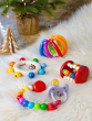 Heimess wooden baby clutching toys pictured on a fluffy white rug