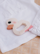 Hevea Natural Rubber Teether - Kawan the Duck on white baby clothes layed out