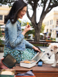 Person enjoying lunch outside with and open Klean Kanteen Rise Stainless Steel Big Meal Box with a small dog taking a look inside