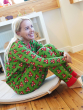 Adult wearing the Maxomorra Holly Long Sleeve adult pyjamas, with playroom shelves and toys in the back ground