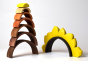 Bumbu solid wooden stacking sunflower arches stacked in a tower on a white background