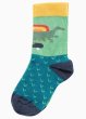 frugi green socks with a dinosaur on