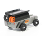 Candylab Drifter Kodiak, a 4x4 off-roader wooden car toy, in grey and black, with metal roof rack and rubber tyres, on a white background, showing side rear view