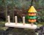 Close up of Plan Toys Sort and Count Tree toy on a wooden log